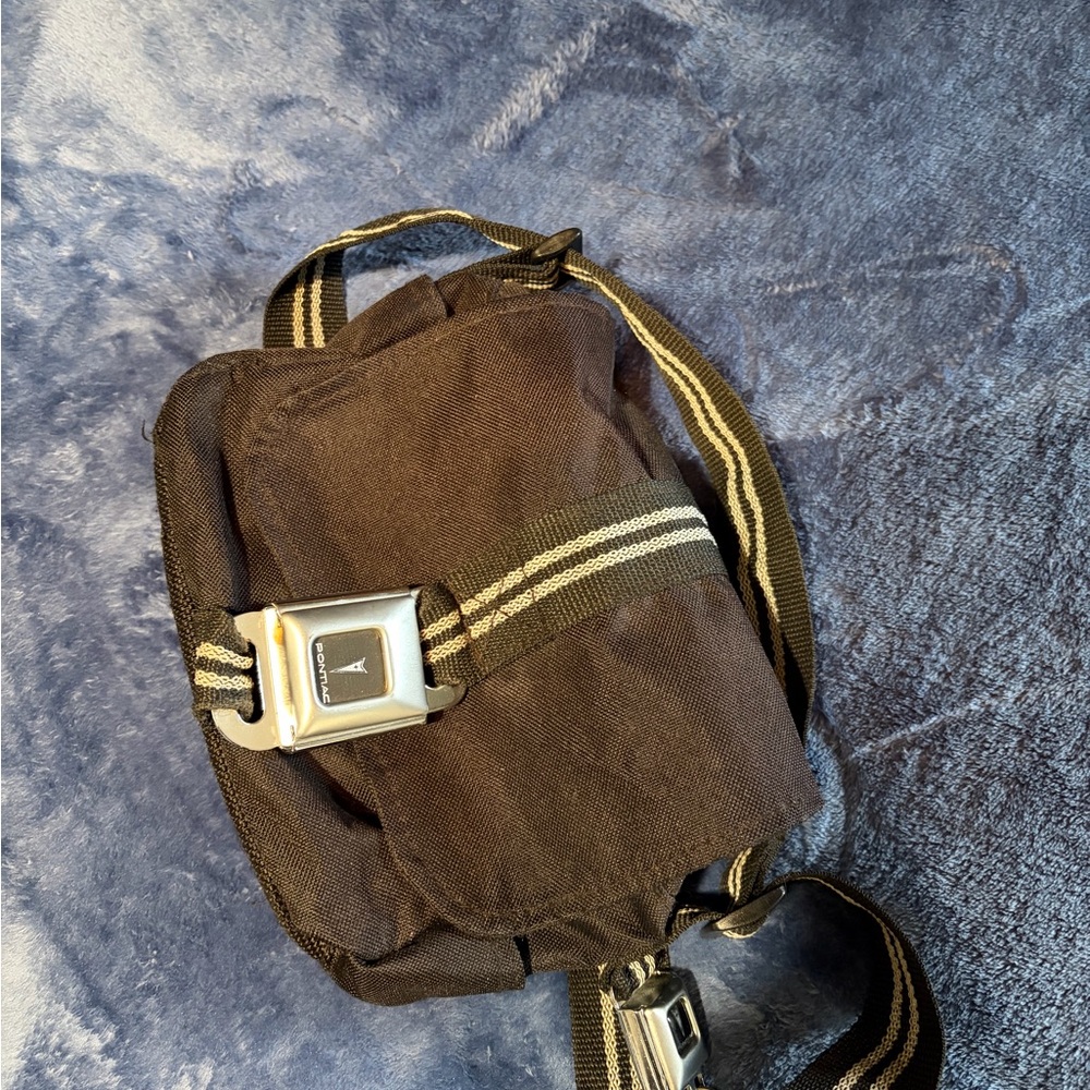 Buckle-Down Black Crossbody Bag with Silver Buckle. Pontiac seatbelt